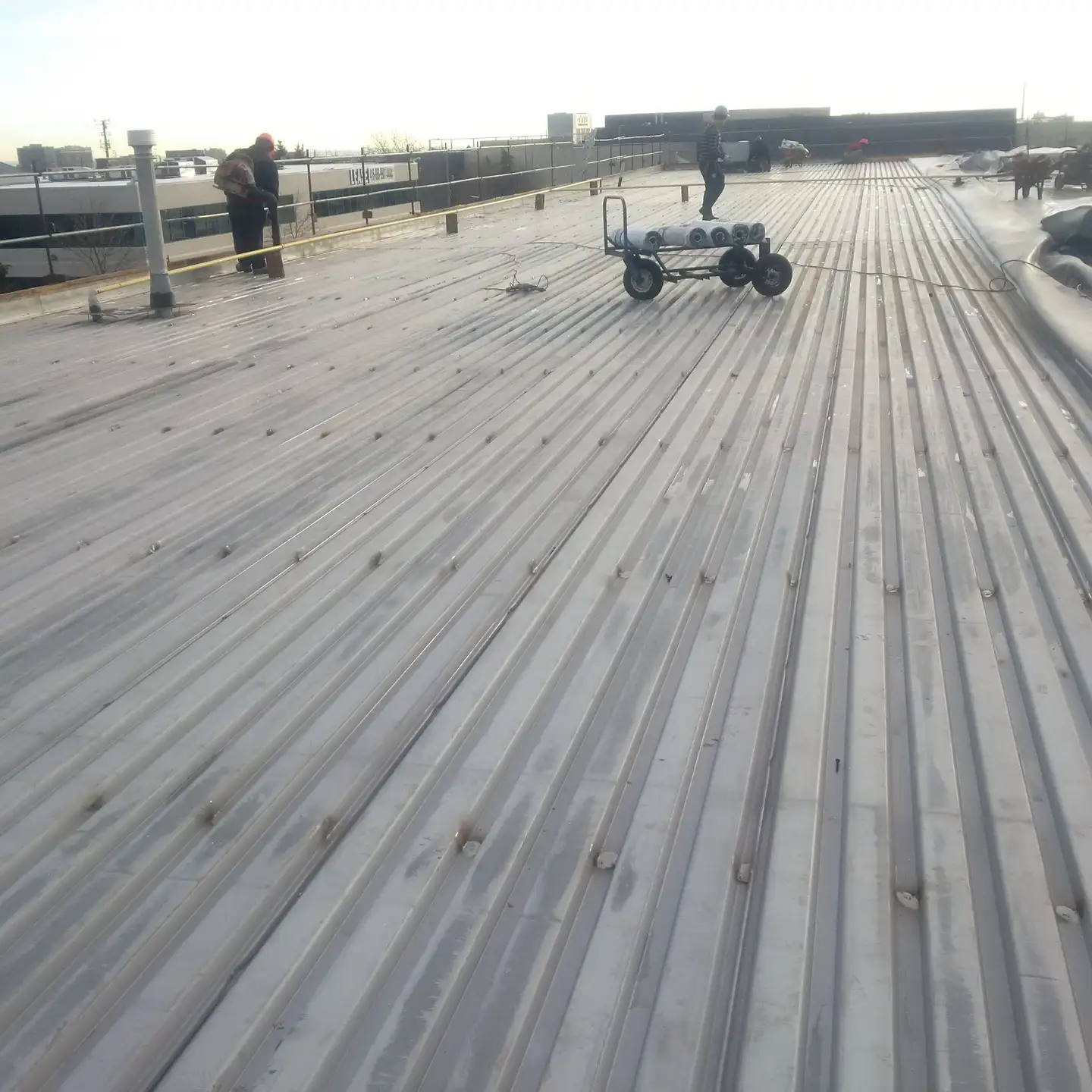 Crawford Roofing crew on a large industrial roof in Ontario